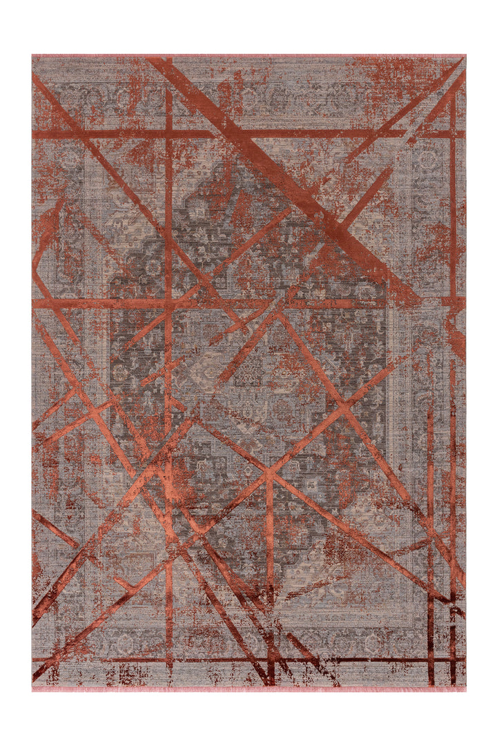 Kırmızı tonlarda, geometrik desenli modern salon halısı. Yumuşak dokulu ve dayanıklı bir yüzeye sahip.