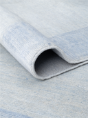 Bamboo Silk Blue & White Hand-Knotted Rug 6'8" x 9'8" ED245 – rolled view
